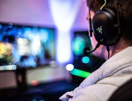 A friendly customer support agent wearing a headset, smiling and ready to assist gamers.